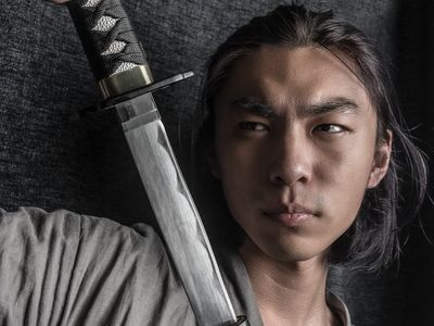 A person holding a stable warrior pose.