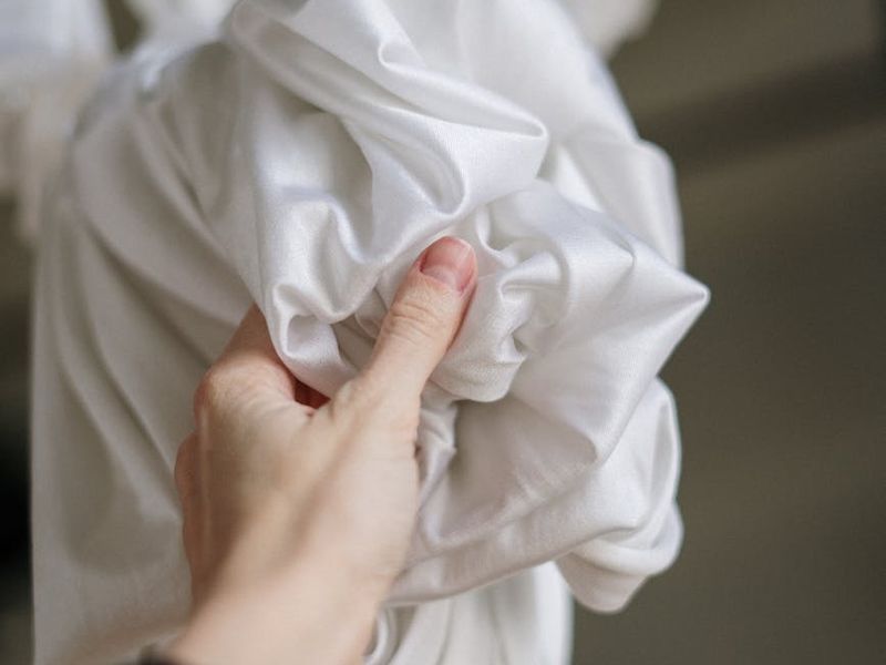 Detailed close-up of hands during a yoga stretch.
